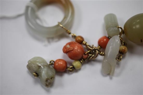 A collection of Chinese gold mounted jade and coral carvings and beads, Qing dynasty, total length 10.5cm